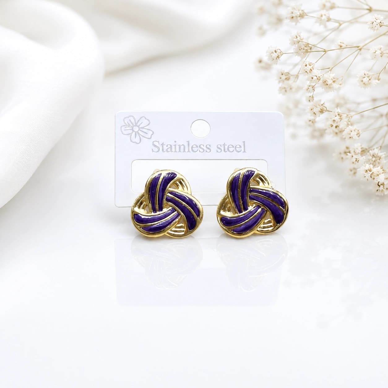 Celeste Purple Gold Interwoven Knot Stud Earrings imitation Earrings by Soni De Nakhre